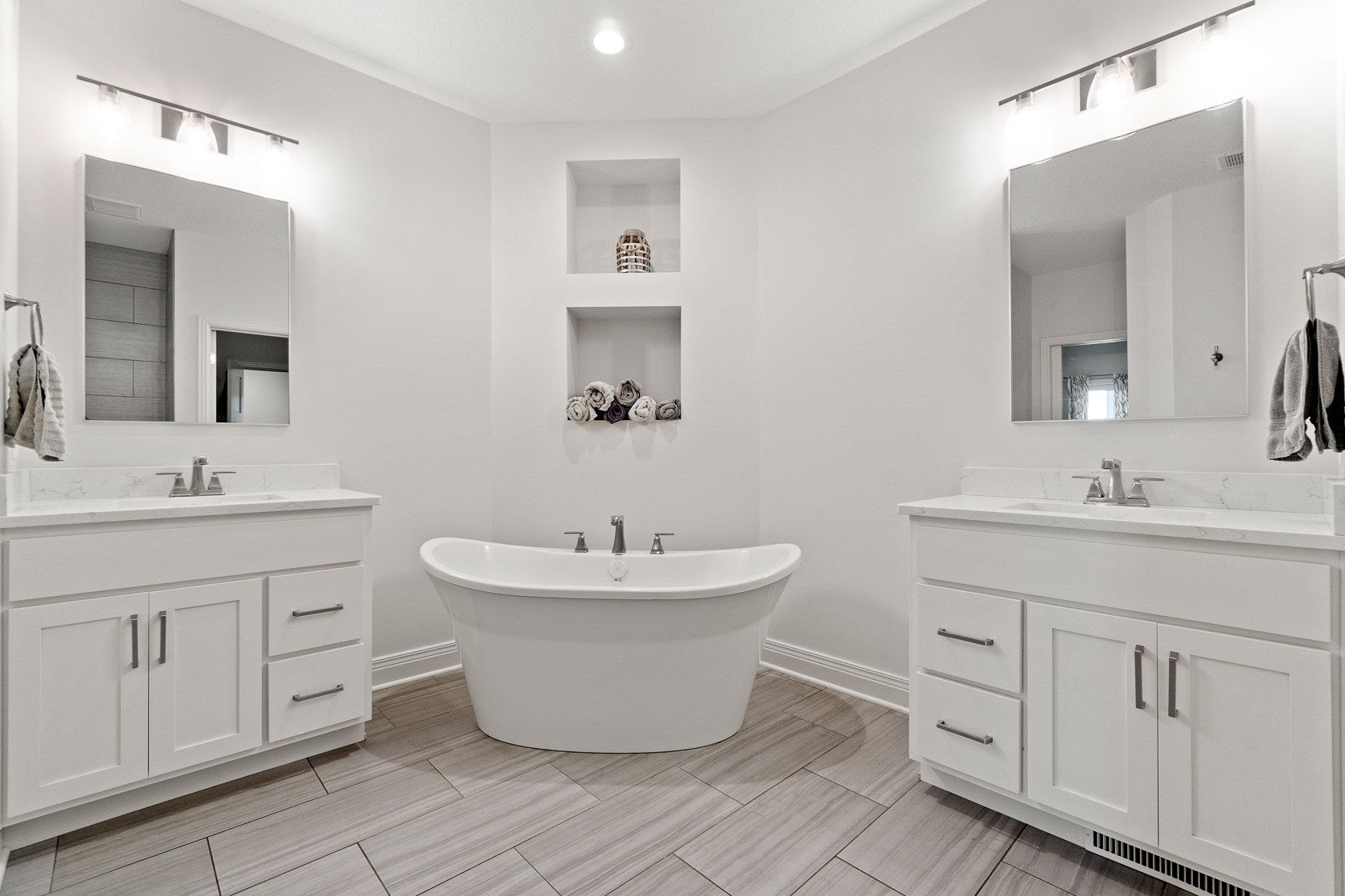 Primary bathroom with freestanding tub and double vanities