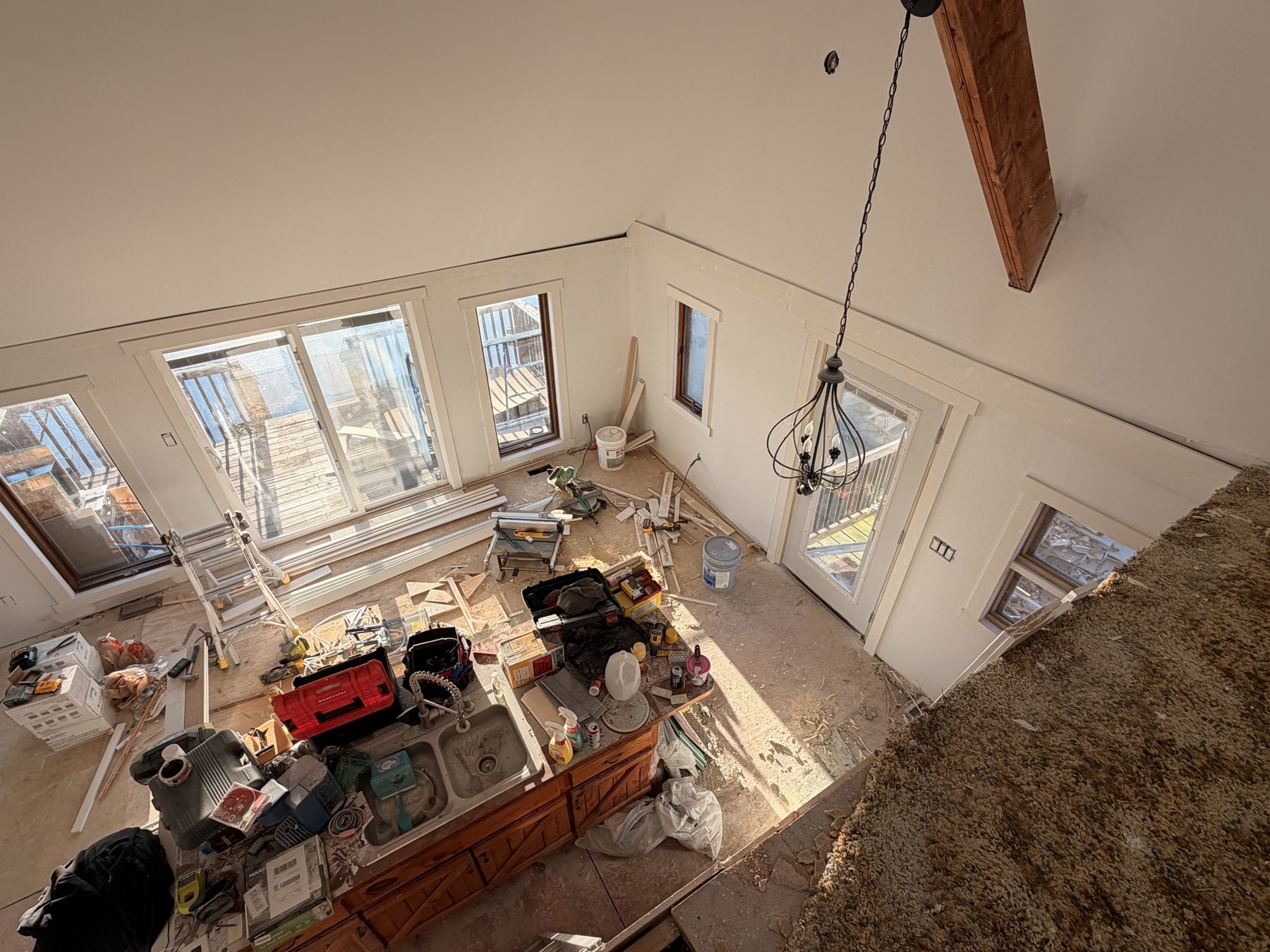 Looking down from the loft during renovation, tools and materials below